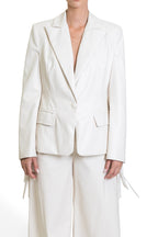 GIACCA IN ECO-PELLE CON FRANGE